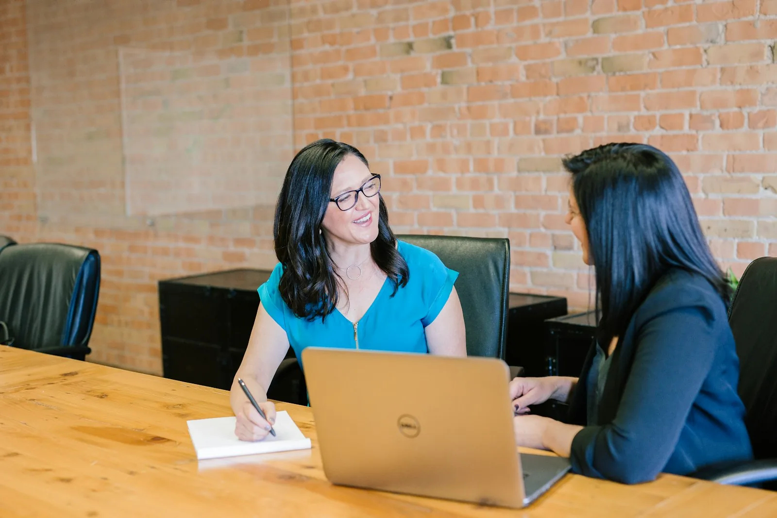 Consultants talking through a project at a table